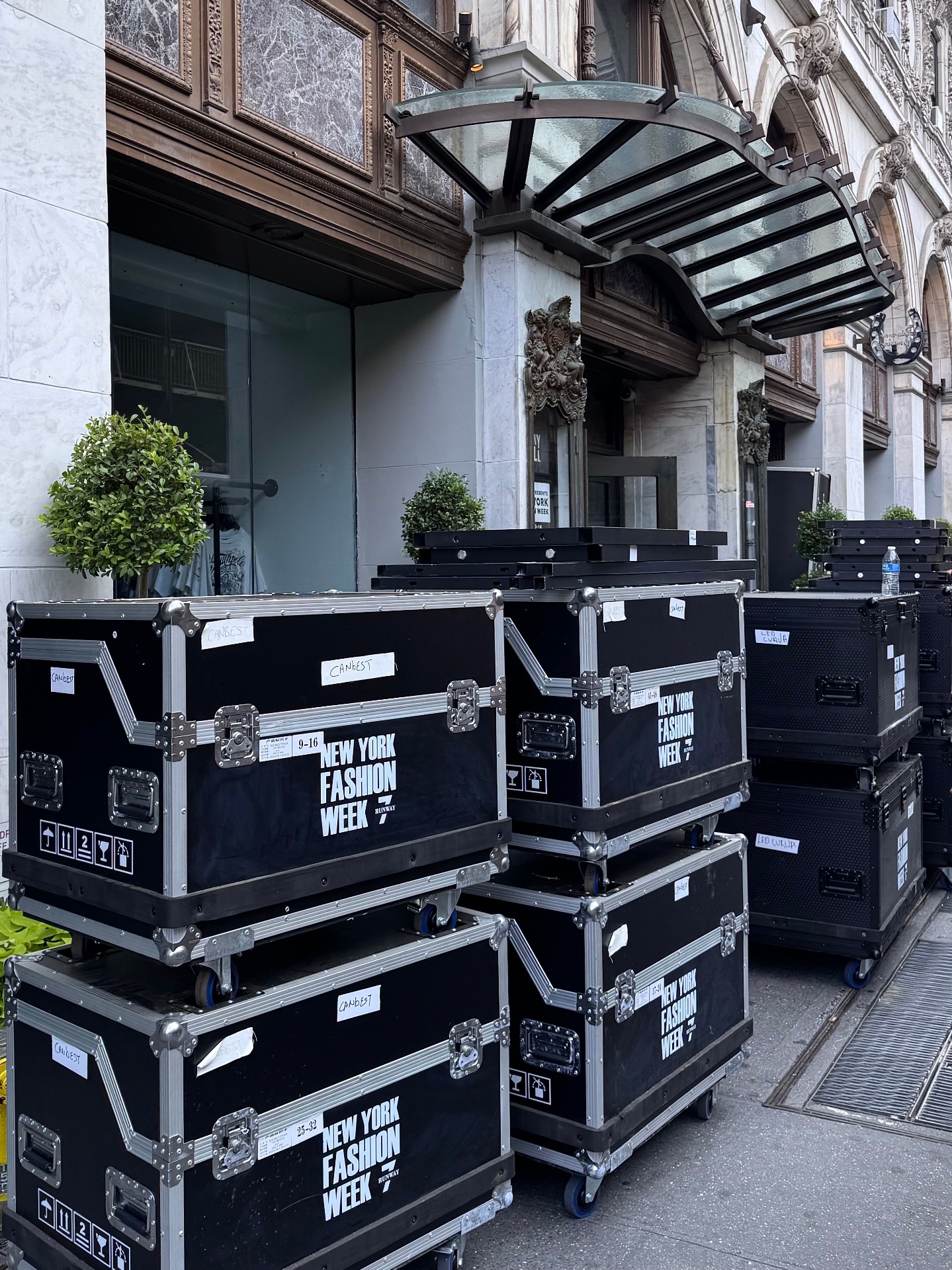 Stacked production road cases arriving on location for a large event load-in